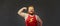 Funny fat man in sports clothes shows a hand with muscles biceps