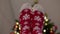 funny feet cozy christmas red socks blurred defocused Christmas tree background