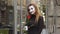Funny female mime in street with flower