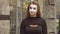 Funny female mime in street shows pantomime. Emotion of fear