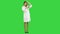 Funny female nurse playing with a stethoscope on a Green Screen, Chroma Key