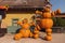 Funny figures made of pumpkins. Halloween street decoration. Happy halloween concept