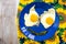 Funny food face smile fried eggs eyes vegetable mouth blue dish