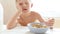 Funny footage of a little pupil not eating his breakfast falling asleep instead