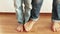 A funny footage of mother and son stepping on each other\'s feet