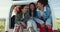 Funny, friends and women in van outdoor in countryside for roadtrip, travel or vacation trip. Group of girls laughing in