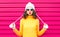 Funny girl blowing red lips makes air kiss wearing colorful knitted yellow sweater hat