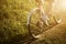 Funny girl driving outdoor. Focus on bicycle. Sunny summer lifestyle concept. Woman in dress and hat in Field with