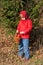 Funny girl picking mushrooms. Fall concept.