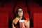 Funny Girl with Popcorn Watching Movie in Cinema Theatre