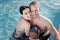 Funny girlfriend and boyfriend grimacing in swimming pool