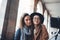 Funny girlfriends taking photo selfie on smartphone mobile. Blogger hipster travels in Barcelona. Holiday friendship lifestyle