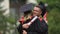 Funny graduate hugging his female friend and laughing, achievement, happy future