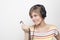 Funny grimacing young woman with headphones