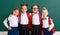 Funny group children   schoolboy  and schoolgirl, student boy  and girl about school blackboard