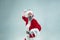 Funny guy in christmas hat. New Year Holiday. Christmas, x-mas, winter, gifts concept.