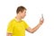 Funny guy in yellow T-shirt taking photos using smartphone, guy with mobile phone, white mockup