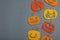 Funny Halloween background. Traditional colorful fall pumpkins with different faces