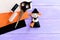 Funny Halloween witch made of felt, scissors, thread set, orange, beige and black felt sheets on wooden background