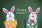 Funny handmade cartoon rabbits placed inside eggs with text Funny handmade cartoon rabbits placed inside eggs with text `Happy Ea