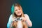 Funny happy woman playing video game with joystick