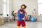 Funny and hardy man in colorful colored sportswear doing sports workout with dumbbells at home.