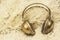 Funny headphones with golden On shaggy bedspread