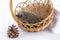 Funny hedgehog sitting to a wicker basket and smiling cheerfully on a white background. Postcard with an animal. Autumn