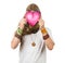 Funny hippie holding a love heart over his face