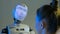 Funny humanoid robot with display face talking with woman