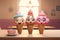 Funny ice cream cones with funny faces on wooden table against blurred background