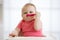 Funny infant baby spoon eats itself