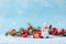 Funny joyful snowman on festive background with Christmas balls and fir sprigs. Christmas New Year card mockup copy