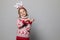 Funny kid with Christmas band. Cheerful smiling little girl .