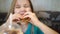 Funny kid girl eats a delicious burger in a cafe. fast food cafes.