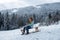 Funny kid in snow ride on sled, sleigh. Winter outdoors games. Happy Christmas family vacation concept. Child sledging