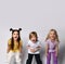 Funny kids dressed in colorful casual clothes. They are screaming while posing isolated on white studio background.