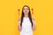 funny lady in white shirt blow kiss with heart on yellow background, womens day