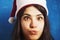 Funny Laughing Christmas girl with red fluffy Santa Hat New Yea