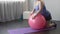 Funny lazy girl lying on big fitness ball, unable to do weight loss exercises