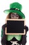 Funny Leprechaun holding a slate with copyspace, on whi