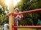 Funny little boy on playground. Cute boy play and climb outdoors on sunny summer day.