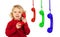 Funny little child talking on the phone and others colorful phones hunging