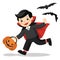 Funny little children in Dracula costume with pumpkin basket