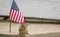 Funny little Eastern Chipmunk stands next to American flag