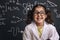 Funny little girl science student in lab coat