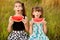 Funny little girls child eating watermelon in summer