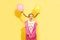 Funny little pretty girl, 7 - 8 years old flies away on balloons tied to 2 pigtails. concept of magic, fantasy, humor, children`s