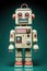 a funny looking AI generated robot toy with a quirky facial expression. dark teal gradient background.