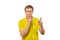 Funny male in yellow T-shirt asking to be quiet, silence gesture, white background